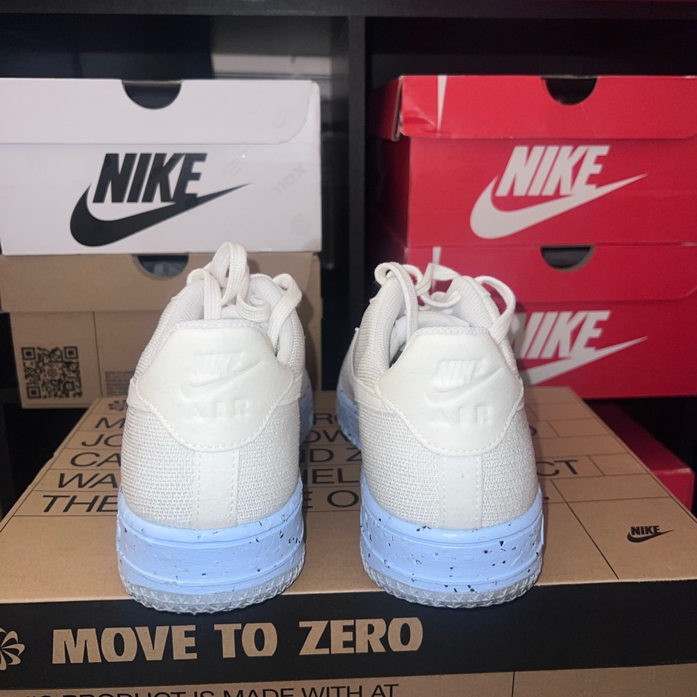 Women’s Nike AF1 Crater Flyknit sneakers. Clean white color.